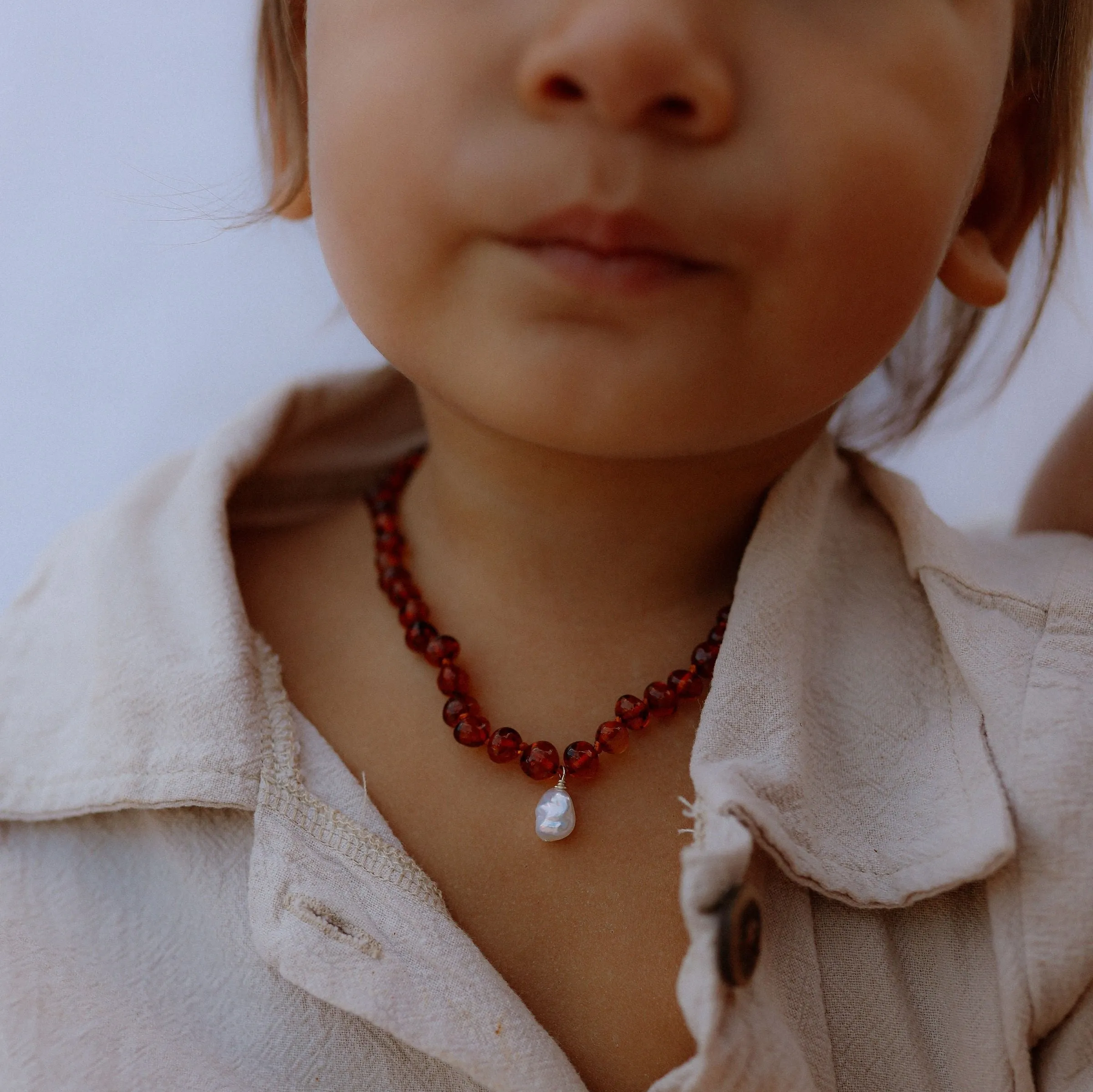 the amber necklace - solid gold